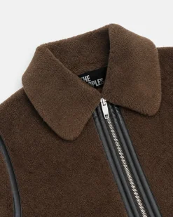 Manteau en fausse fourrue reversible kaki et noir