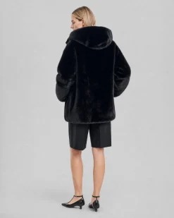 Manteau en fausse fourrure à capuche noir