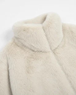 Manteau en fausse fourrure col montant ecru