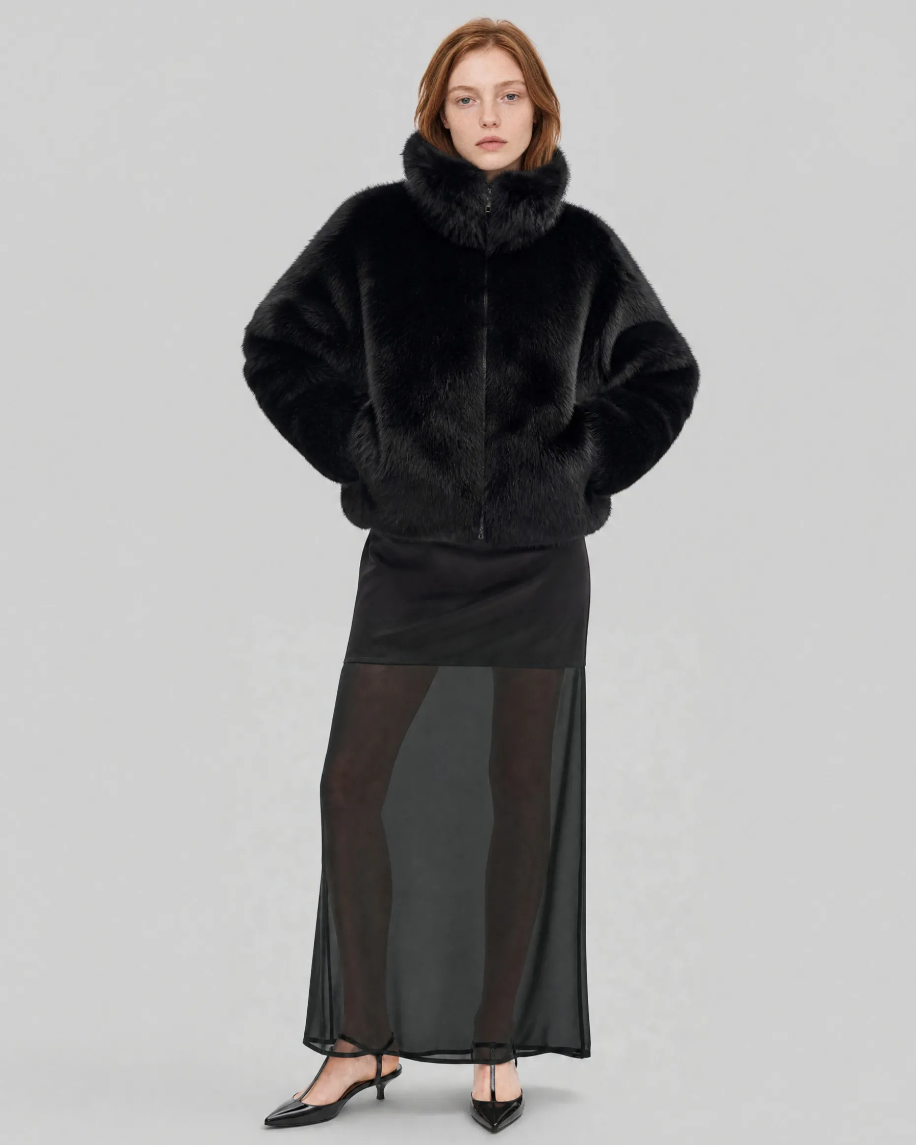 Manteau en fausse fourrure col montant noir