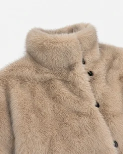 Manteau en fausse fourrure reversible beige et noir