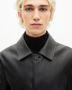 Manteau mi-long en cuir noir
