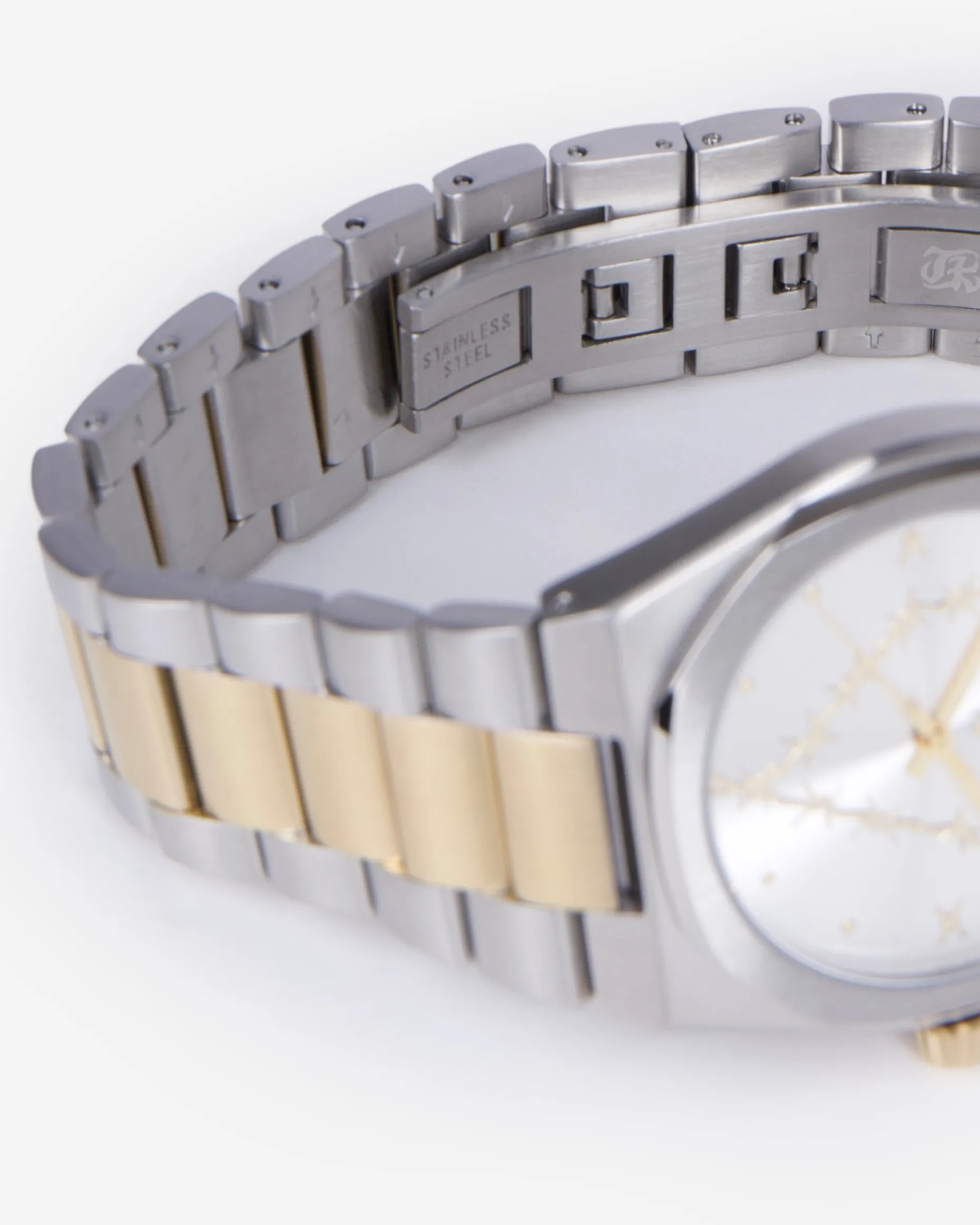 Montre avec coeur dorée et argentée