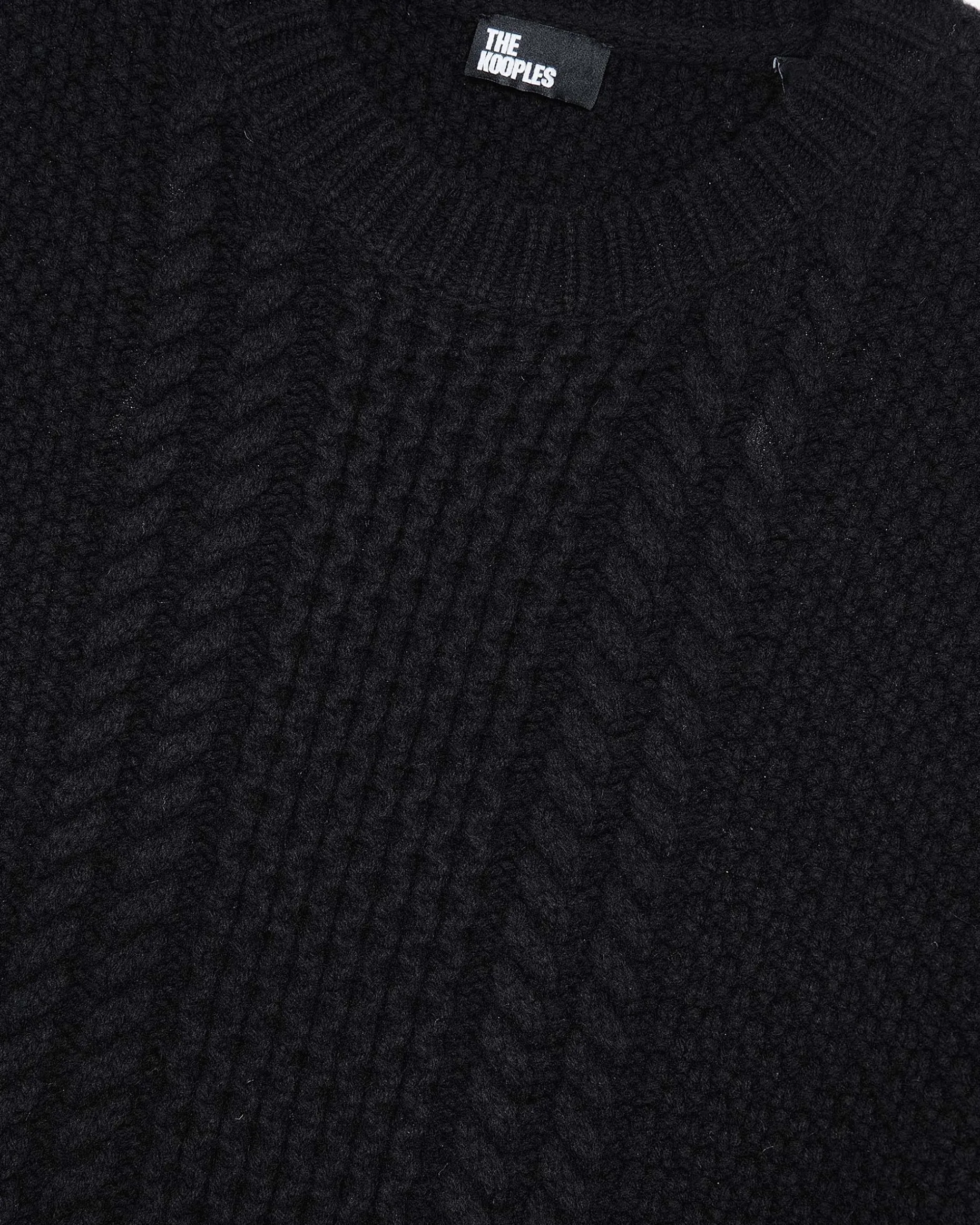 Pull torsadé en laine noir